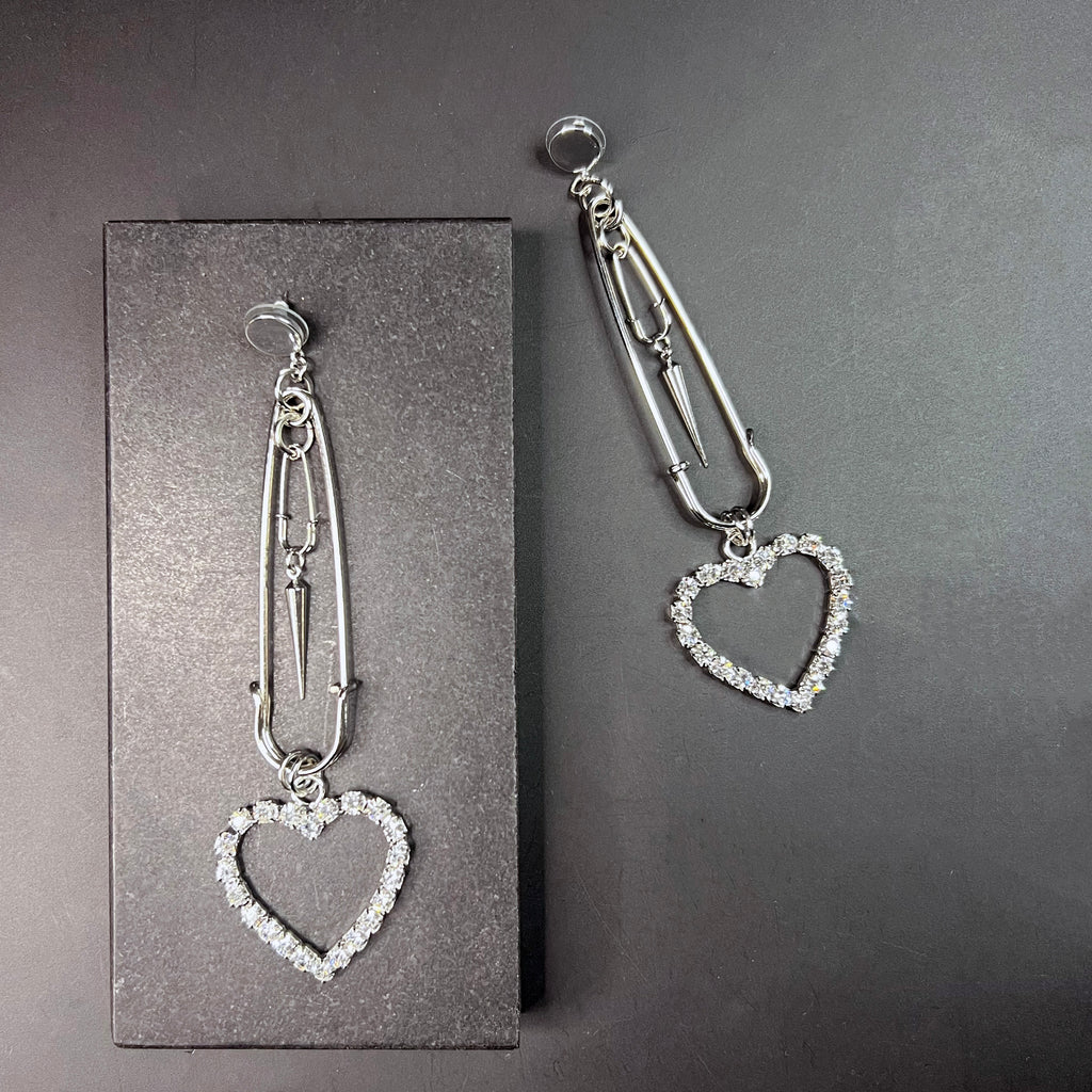 Edgy silver heart earrings with safety pin shape – minimalist punk-inspired drop earrings