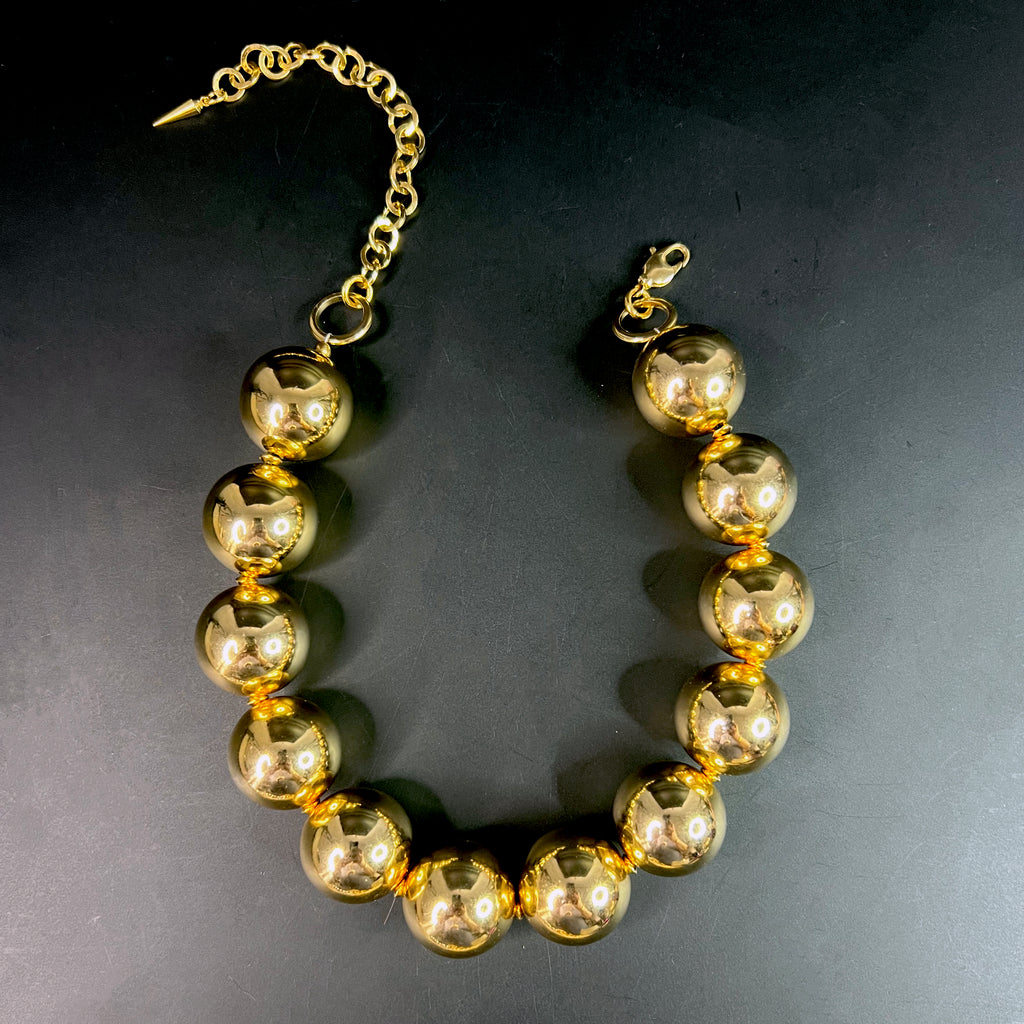 Oversized gold bead choker necklace with high-shine finish – sculptural statement jewelry