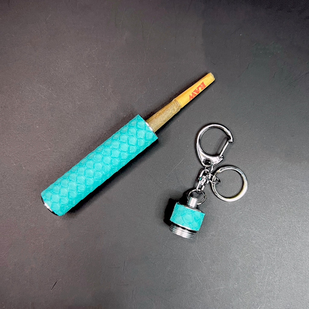 Luxury keychain stash tube with Tiffany blue python wrap displayed open and closed