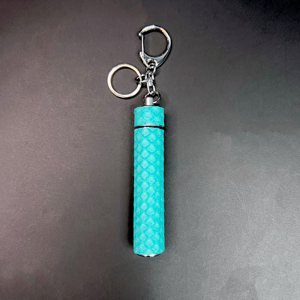 Tiffany blue python skin J carrier keychain styled as a fashionable bag charm