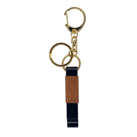 Tan ostrich leg leather wrapped matte black and gold bottle opener key chain