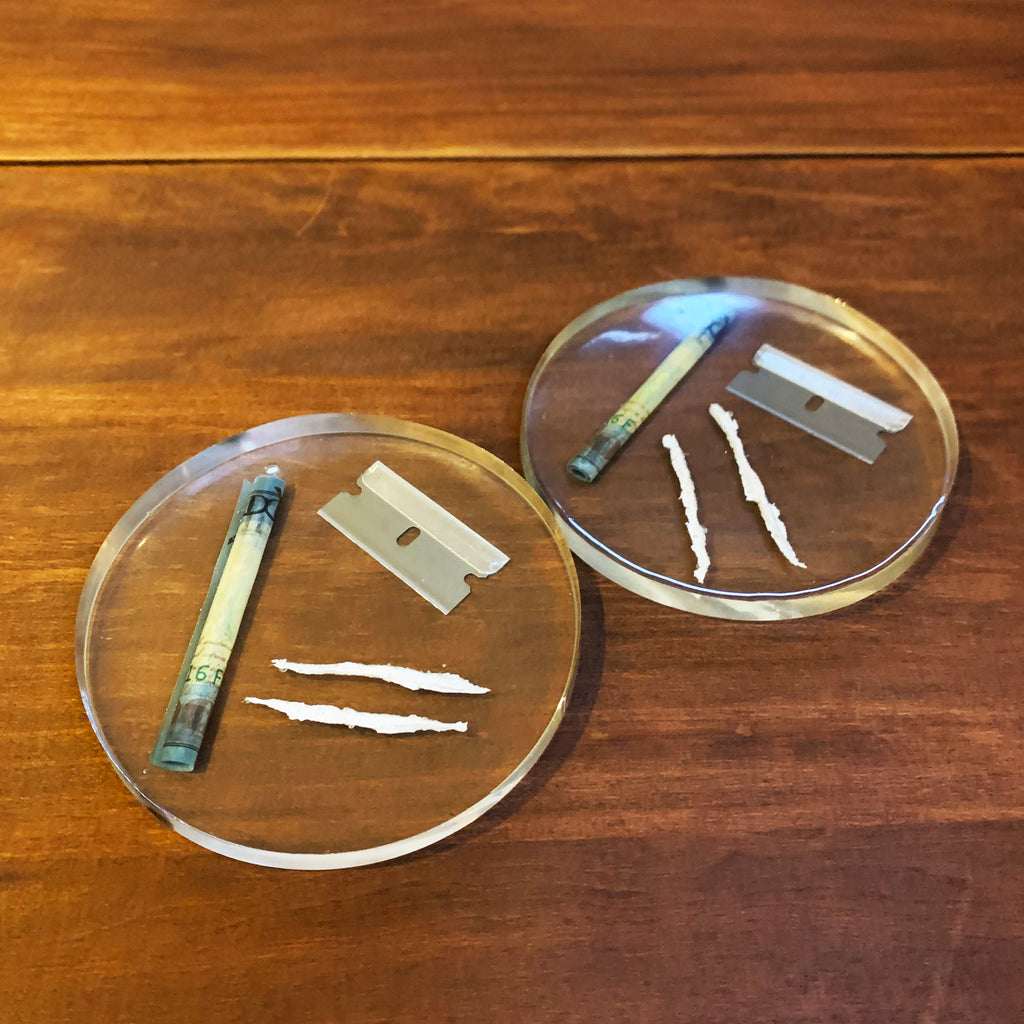 Clear resin drink coasters with rolled $100 bill, razor and faux coke lines inside