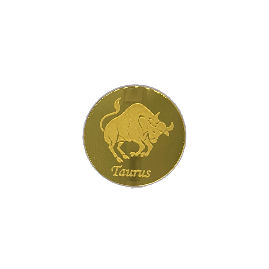 Round, gold mirrored acrylic drink coasters engraved with the Taurus astrology symbol