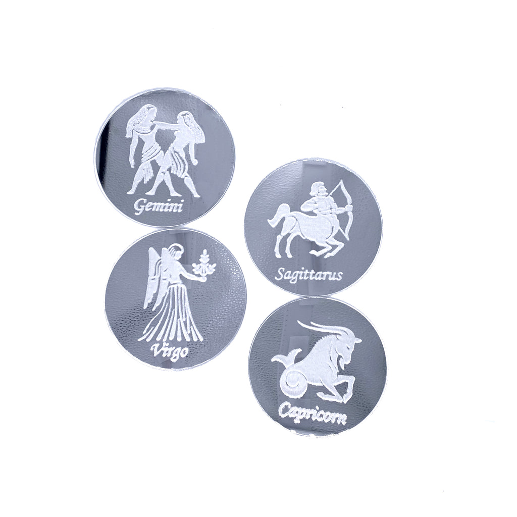 Round silver mirrored drink coasters engraved with astrology signs