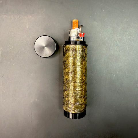 Metallic Gold Python Dugout with the top removed, revealing the internal setup — lighter, one-hitter, and poker tool neatly stored inside against the black matte cap.