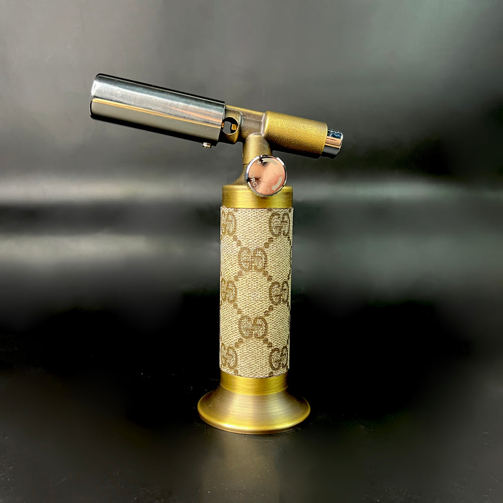 Side angle of vintage GG wrapped torch showing canvas wrap and brass detailing.
