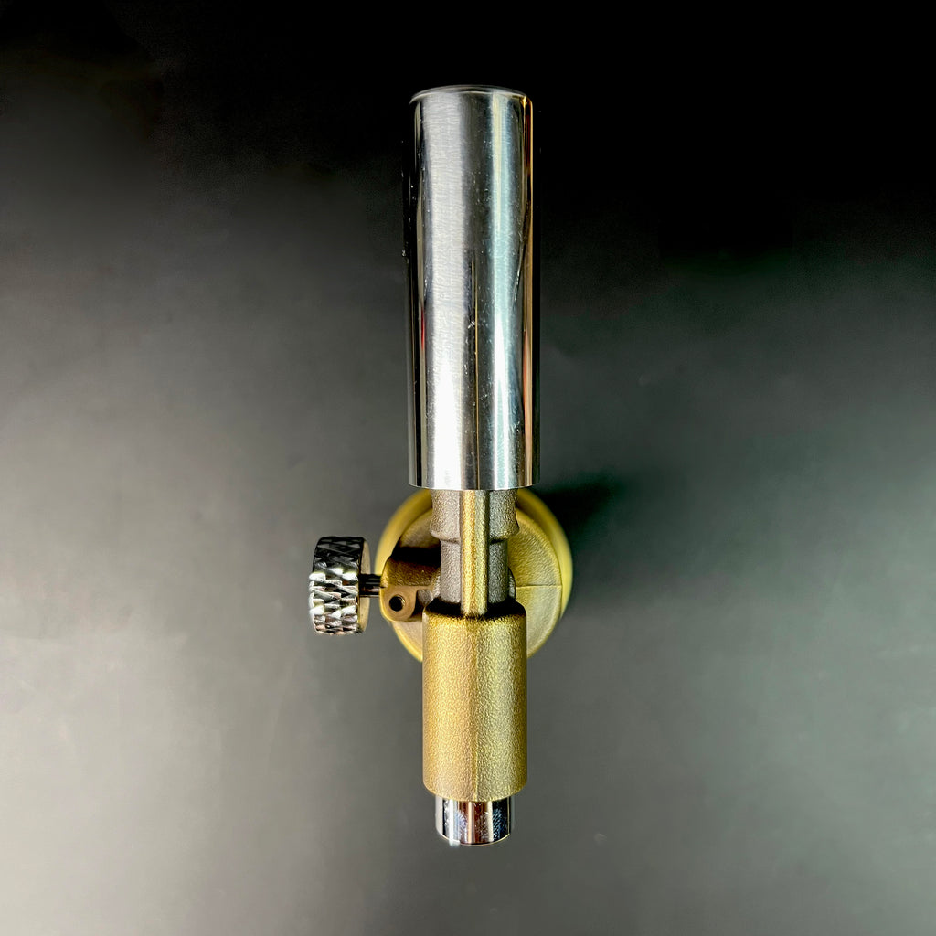 Top-down view of vintage GG wrapped torch highlighting the polished chrome flame barrel.