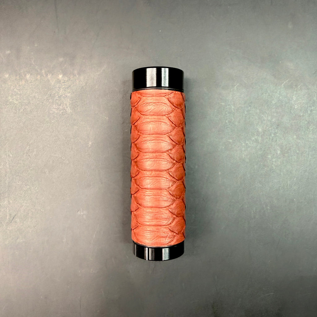 Full view of the Matte Syrah Python Dugout standing upright on a dark surface, showcasing the rich red tone and matte finish of the python leather.