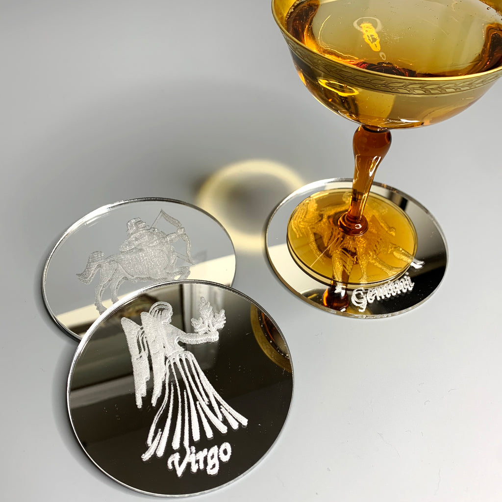Round silver mirrored acrylic drink coaster engraved with the Virgo astrology sign